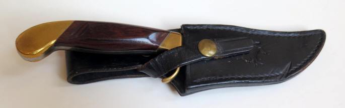 Colt U1120 General Purpose knife with a 4.5 in. blade and rosewood handle in leather sheath