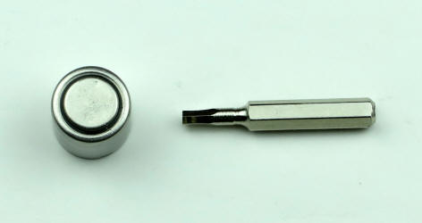 Colt red dot sight 3V Duracell battery removal tools close-up
