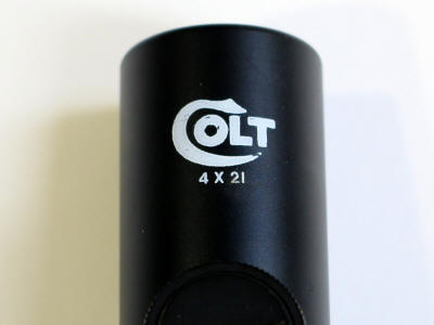 Colt logo is forward of the adjustment turret