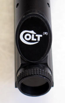 Colt logo pinted on back of scope