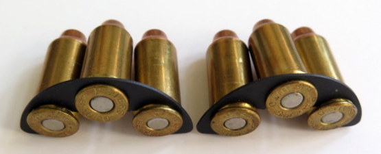 Metal .45 cal. half-moon ammo clips for .45 cal. ammo.
