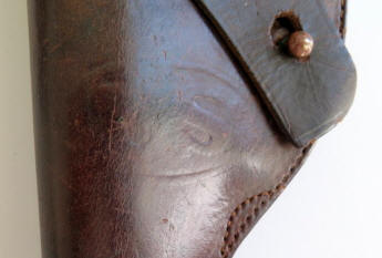 Oval 'U.S.' imprint on holster and leather leg strap